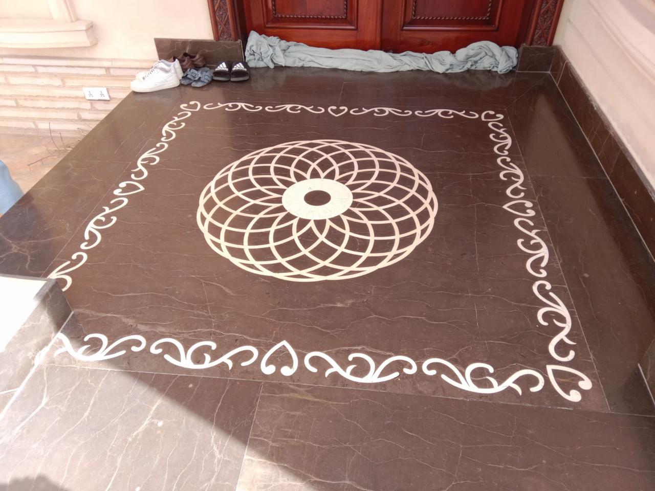 Custom marble floor geometric design installed by Al-Hamd Granite Karachi